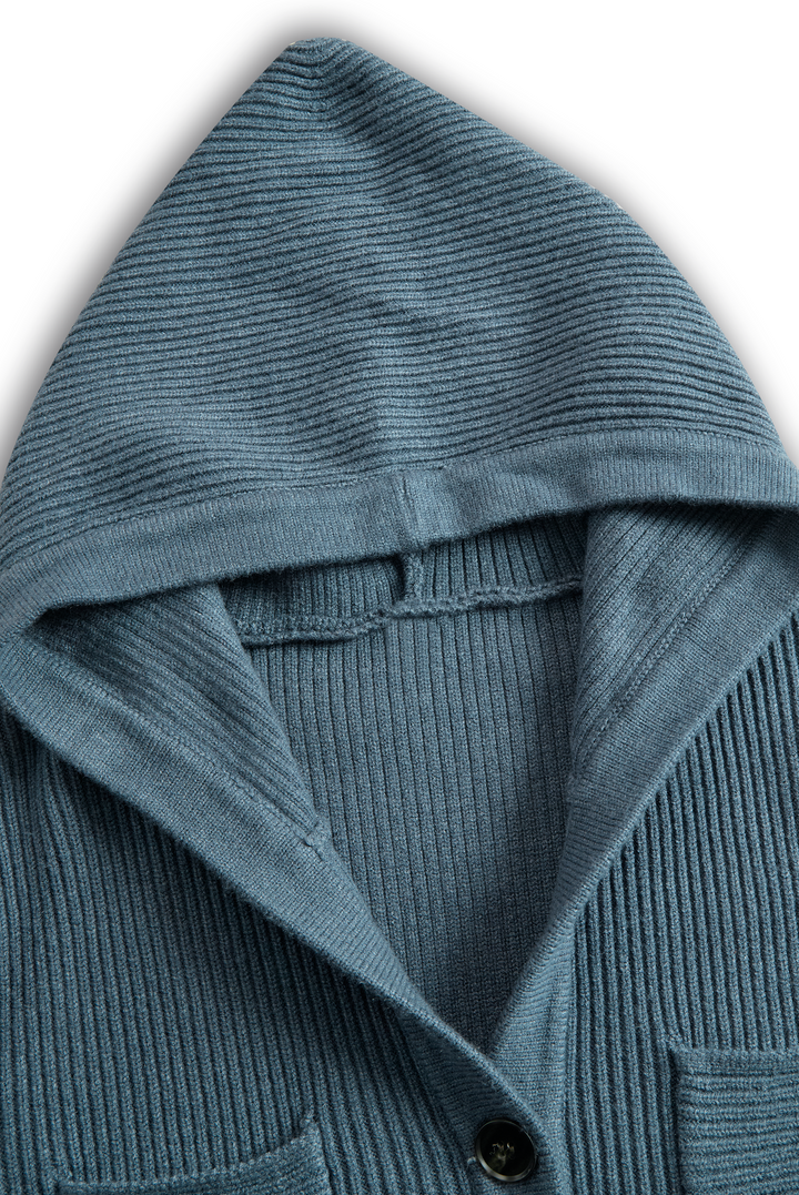 Detailed view of a blue ribbed hood from a maxi dress, showcasing fabric texture.