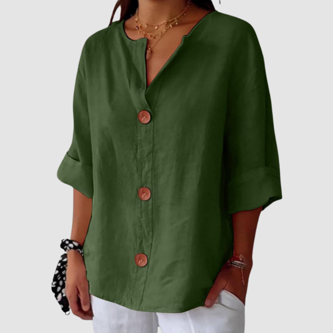 Green casual blouse with button-down style, relaxed sleeves, against a plain backdrop.