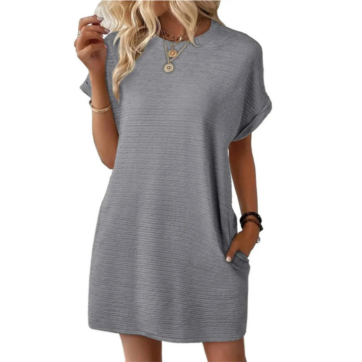 Classic gray casual dress with short sleeves and a loose fit, worn with fashion jewelry in a studio environment.