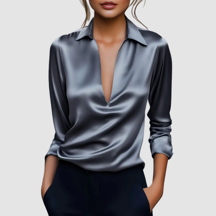 Stylish dark gray satin blouse with a deep V-neck, captured in a studio setting.
