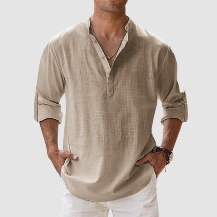 Taupe long-sleeve breathable shirt with banded collar, button placket, white pants in studio.