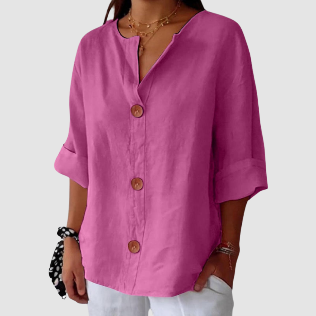 Pink casual blouse featuring a comfortable fit and button detail, on a plain background.