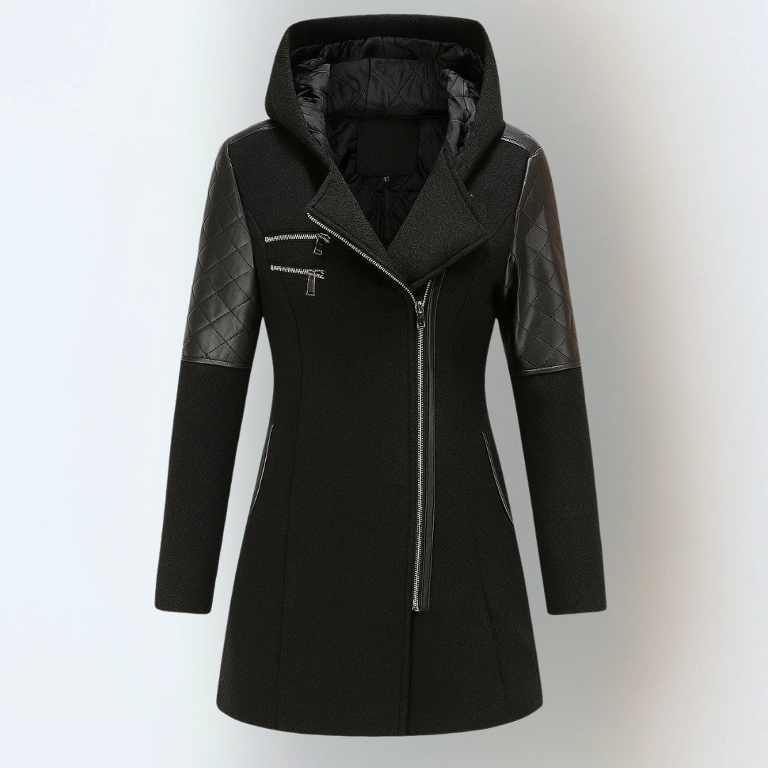 Black hooded winter jacket with black quilted sleeves and asymmetrical zipper, studio background.