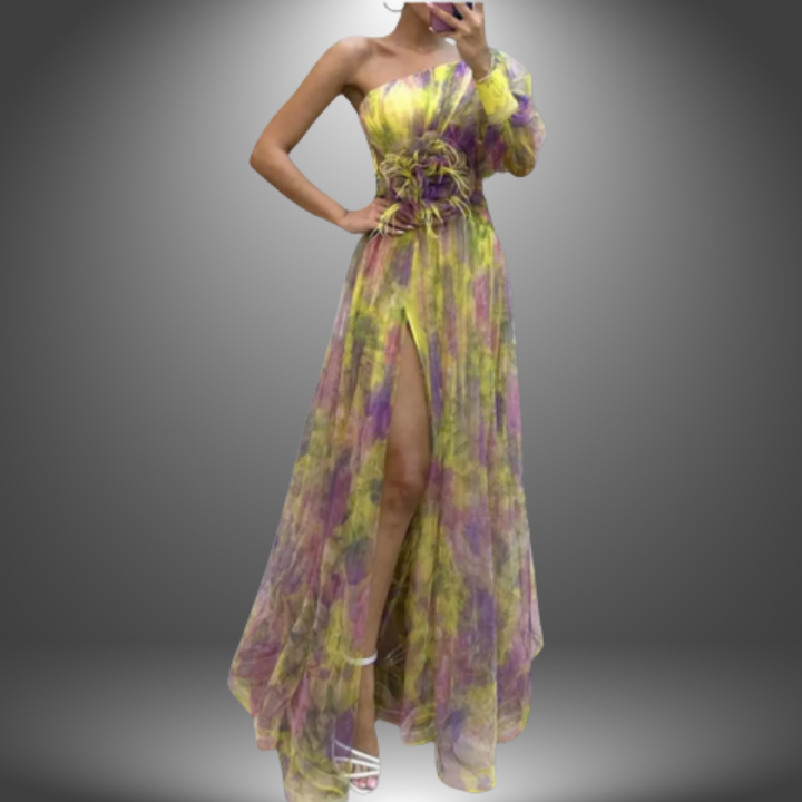 Yellow and purple elegant dress with one shoulder design, floral waist accent, and high slit in a soft gradient studio setting.