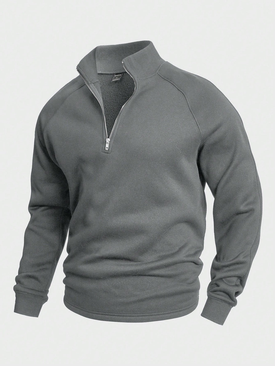 Gray zip sweater with high collar and long sleeves, presented in a studio setting.