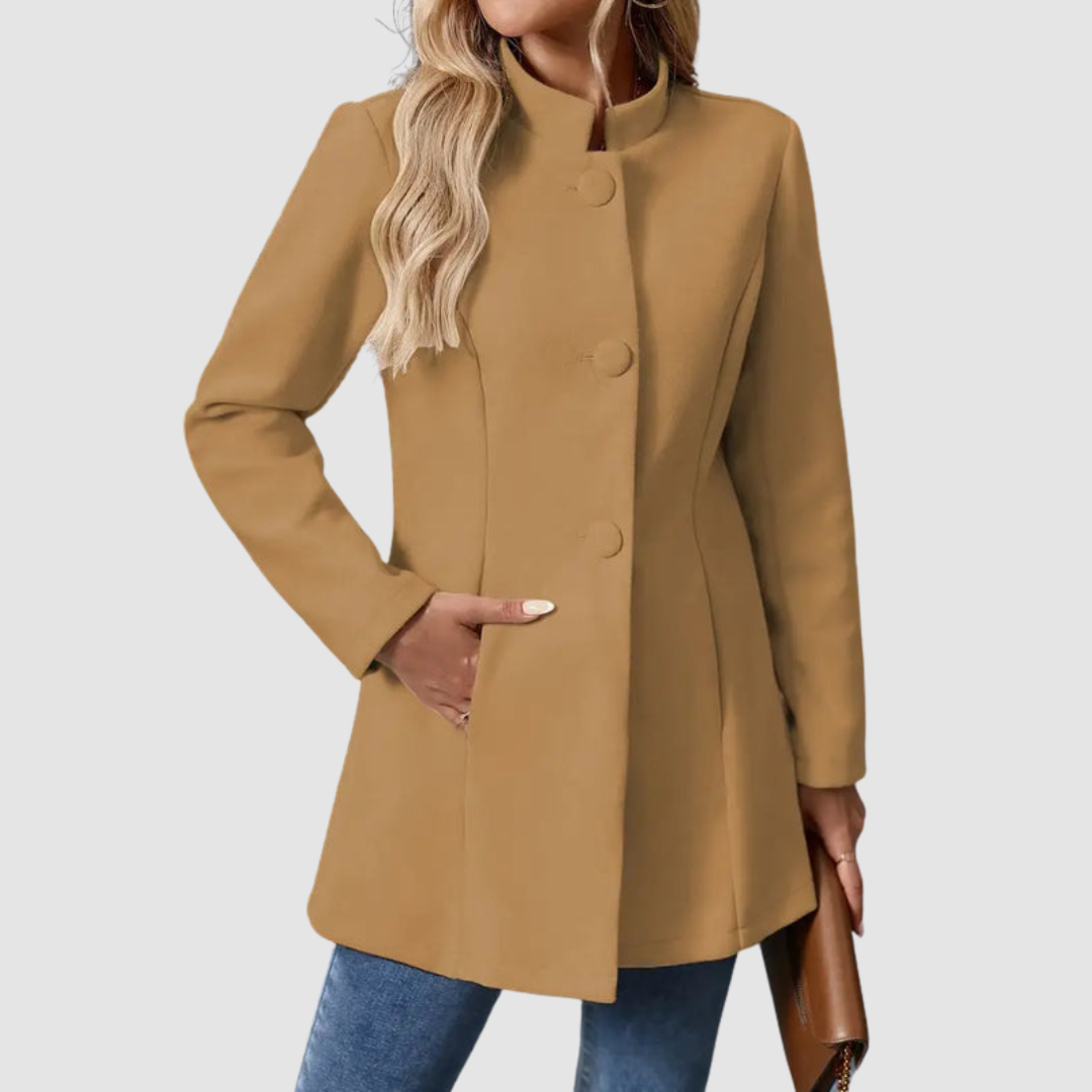 Brown jacket with large buttons, model torso view, hand in pocket, against plain background.