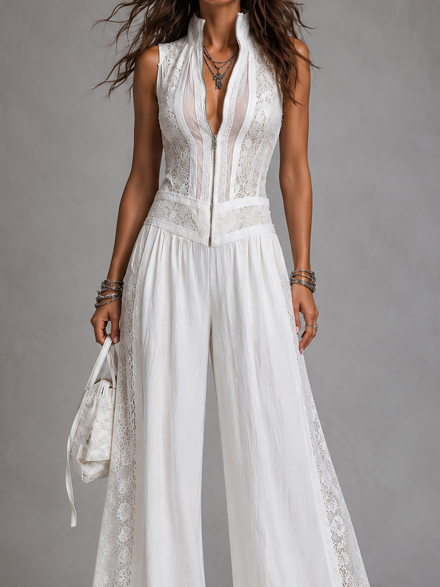 Front view of white lace-trimmed, wide-leg jumpsuit with stand collar, studio setting.