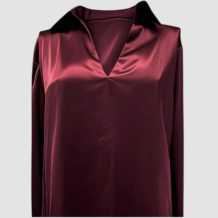 Burgundy satin blouse showing a straight front view in a studio environment.