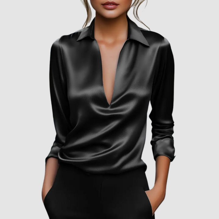 Elegant black satin blouse with deep V-neck, worn in a studio setting.