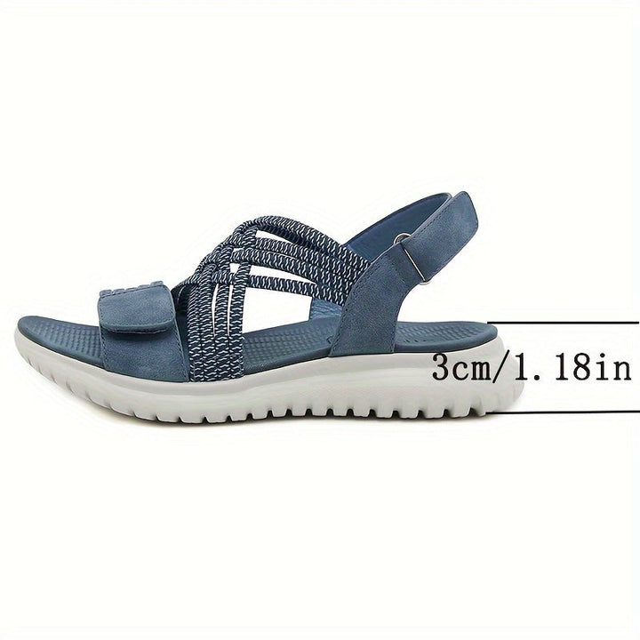 Side view of blue orthopedic sandal with crisscross straps, heel height shown as 3cm/1.18in.