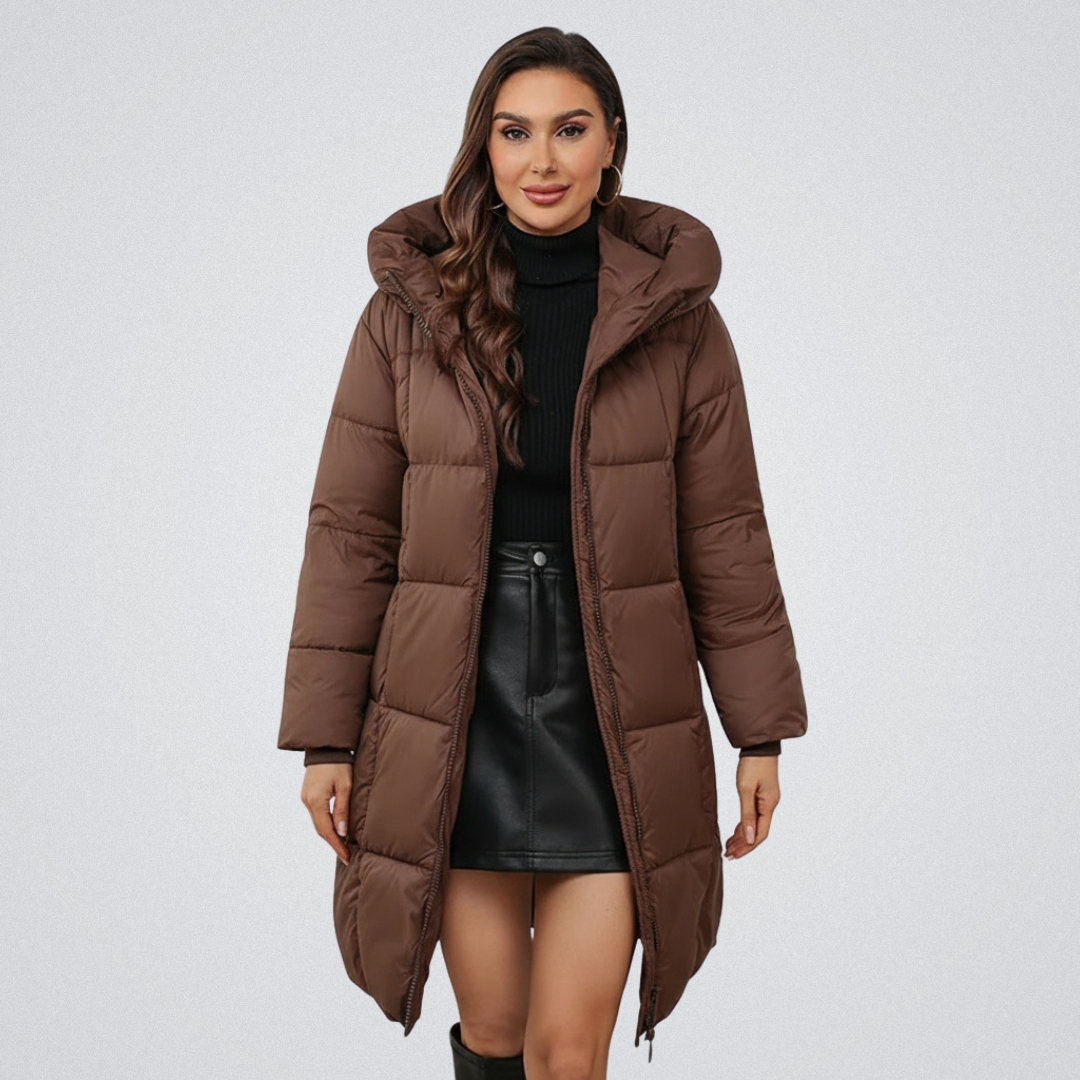 Woman in a brown puffer coat with hood, styled with a black turtleneck and black skirt, on a white background.