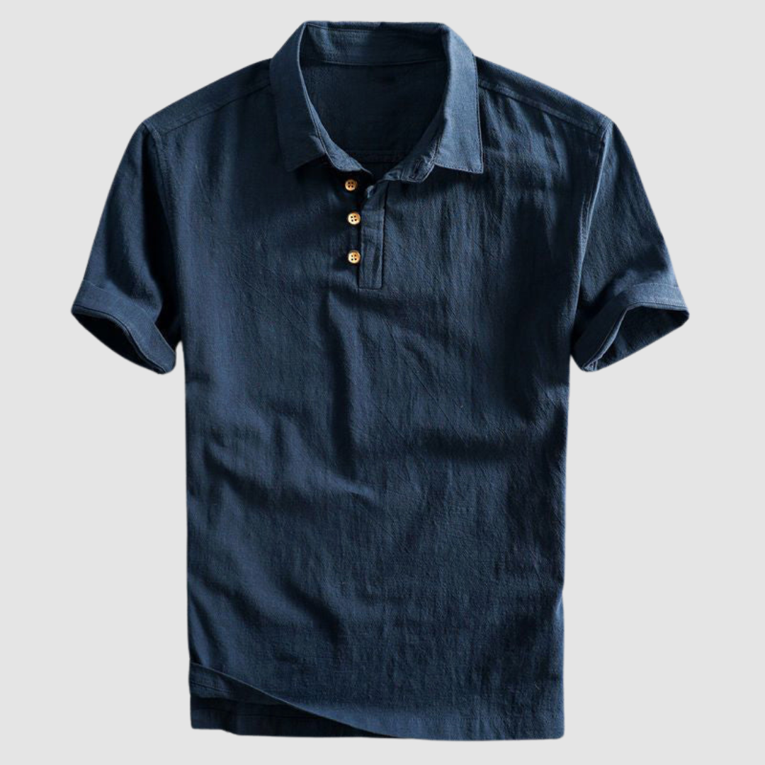 Dark blue short-sleeve polo shirt with buttons, displayed on a plain light gray background.