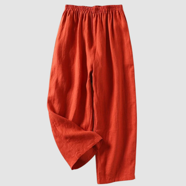 Orange relaxed-fit pants with elastic waistband, styled on a light gray background.
