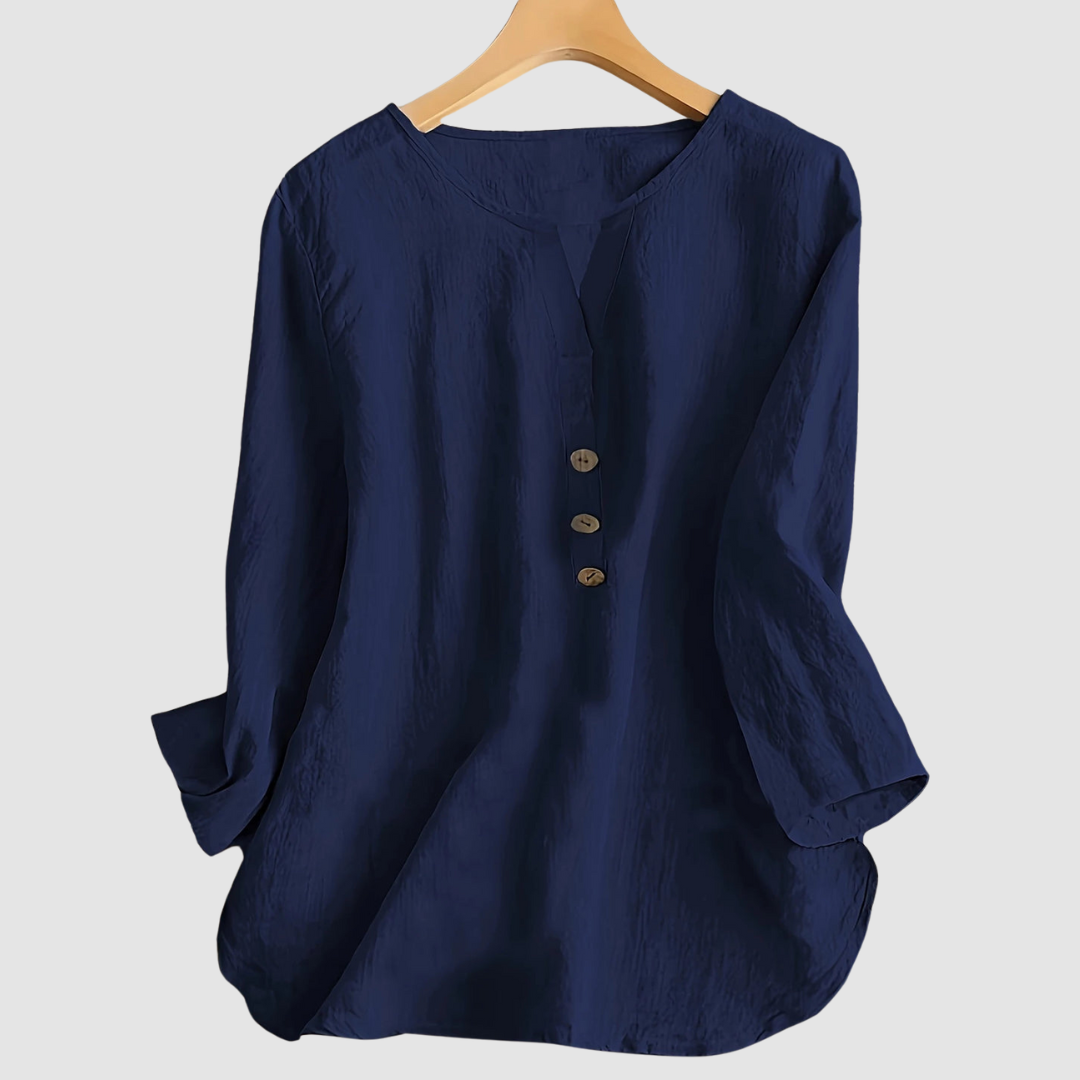 Navy casual blouse with button detail displayed on a hanger against a plain background.