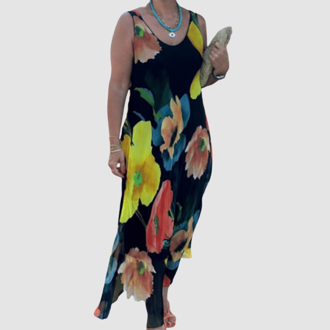 Front view of a black floral dress with vibrant blooms, worn by a model carrying a clutch on a plain background.