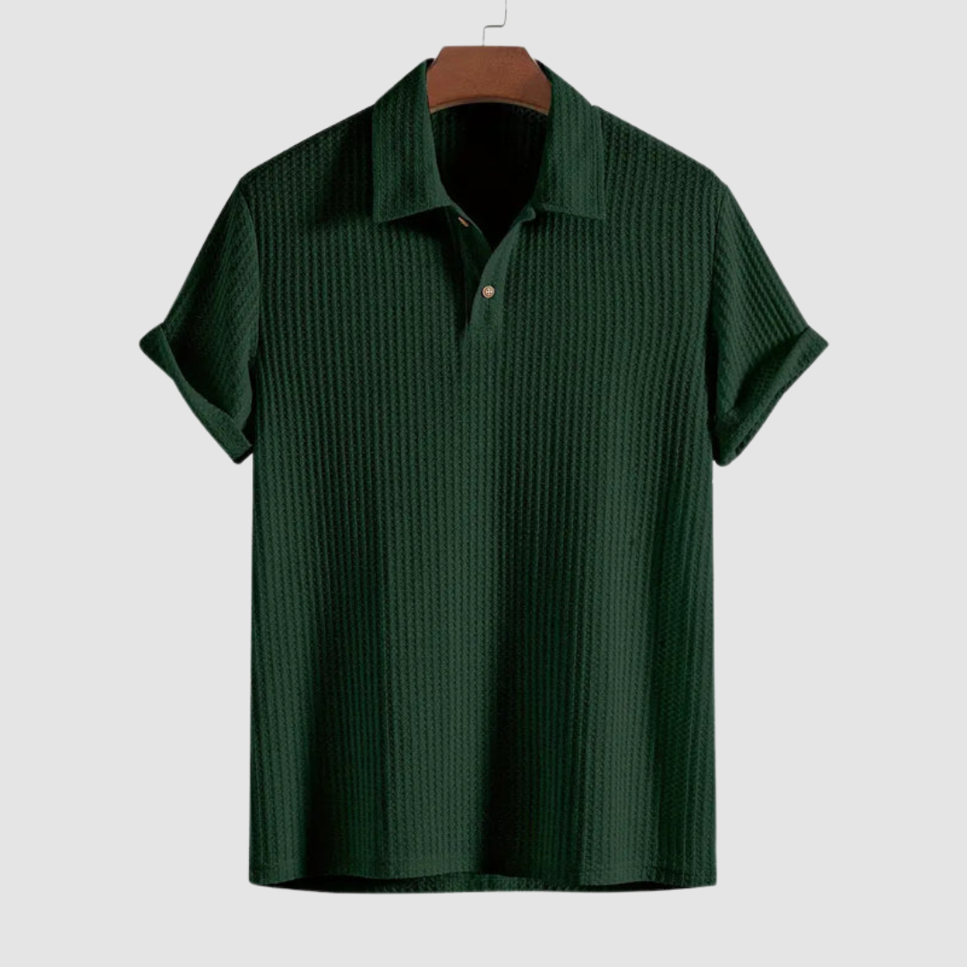 Dark green textured polo shirt on a hanger against a plain light gray background.