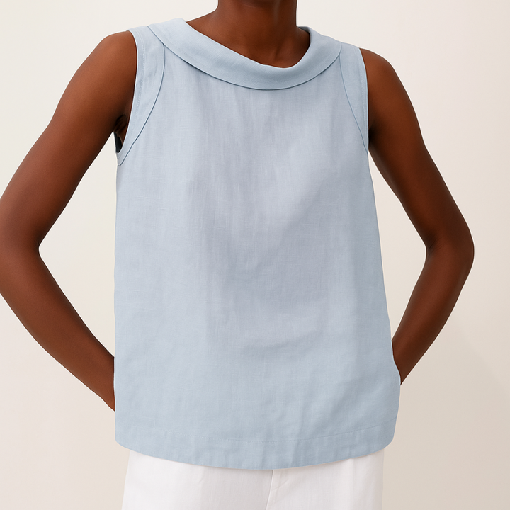 Light blue sleeveless top with roll collar on model, paired with white pants, against a light background.