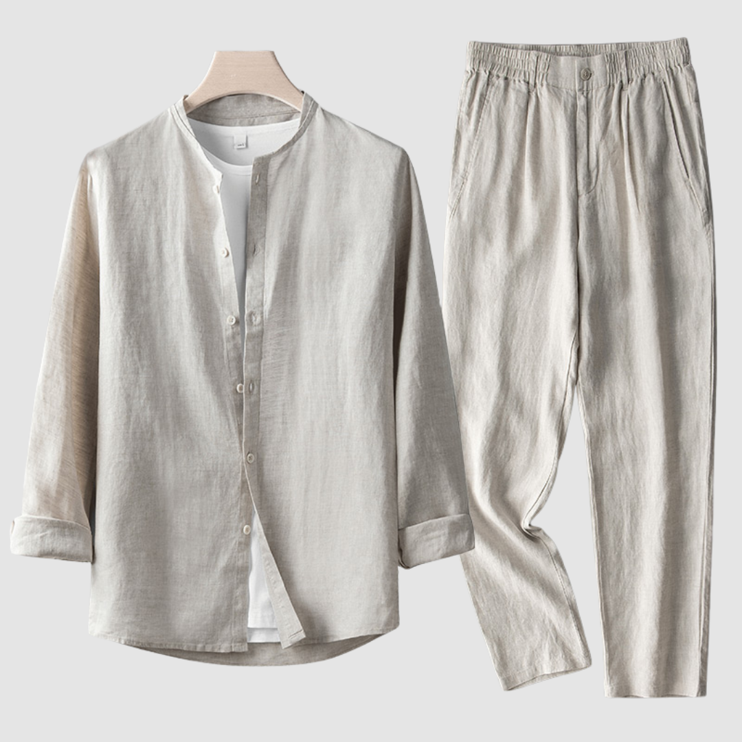 Light beige shirt and pants set on a wooden hanger against a plain background.