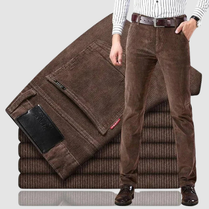 Brown corduroy trousers shown in a studio setting, highlighting the rich texture and casual style.