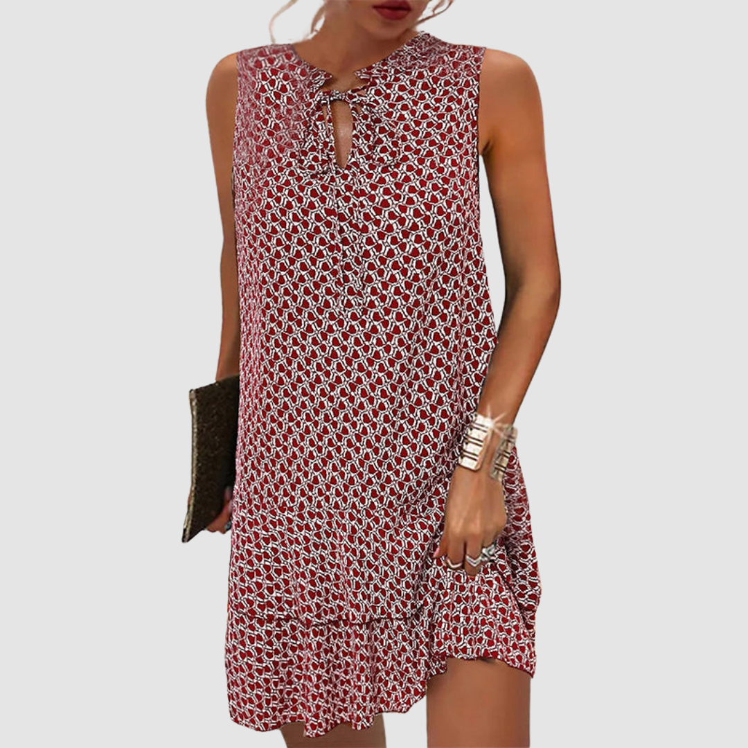 Red sleeveless dress with geometric pattern, keyhole neckline, white background.
