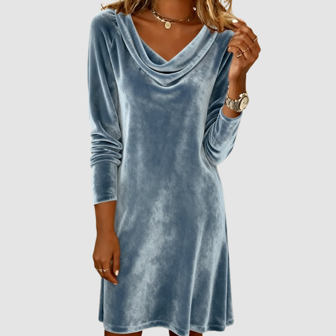 Light blue velvet long sleeve dress with a draped neckline on a white background.