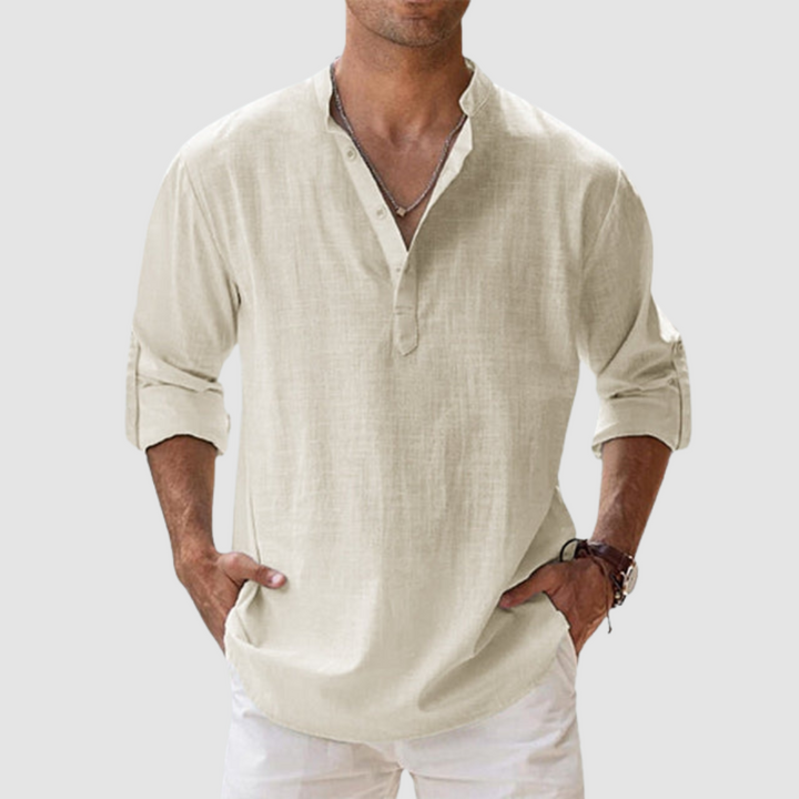 Beige long-sleeve breathable shirt with banded collar, button placket, white pants in studio.