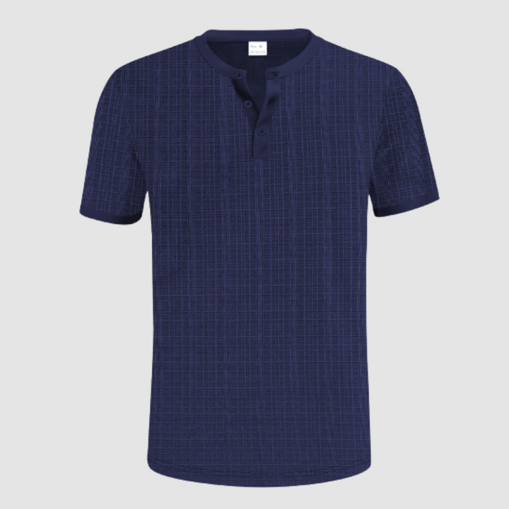 Dark navy short-sleeve shirt with gridline design, Henley neckline, in a studio setting with white background.