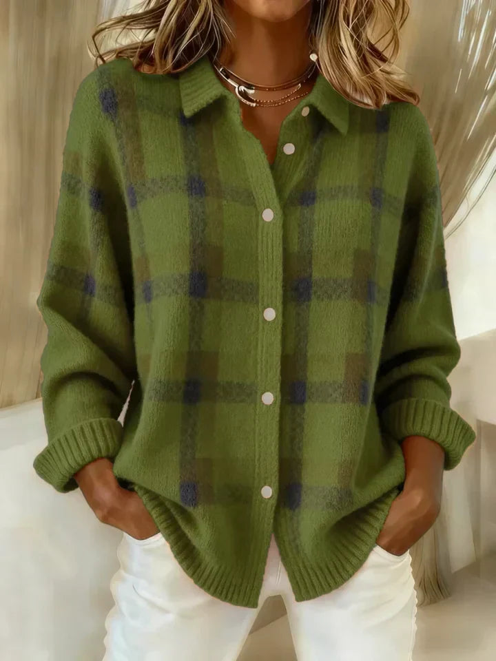 Green plaid button-up shirt, features a relaxed fit, worn indoors against a soft background.