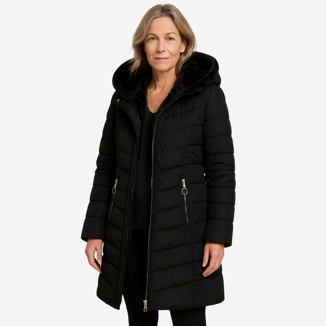 Model wearing a black fur-lined down jacket with a hood, front view, studio background.