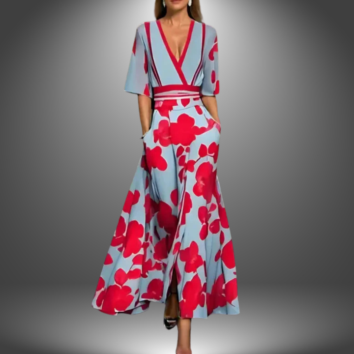 Elegant dress with red floral pattern on light blue, V-neck, short sleeves, studio background.