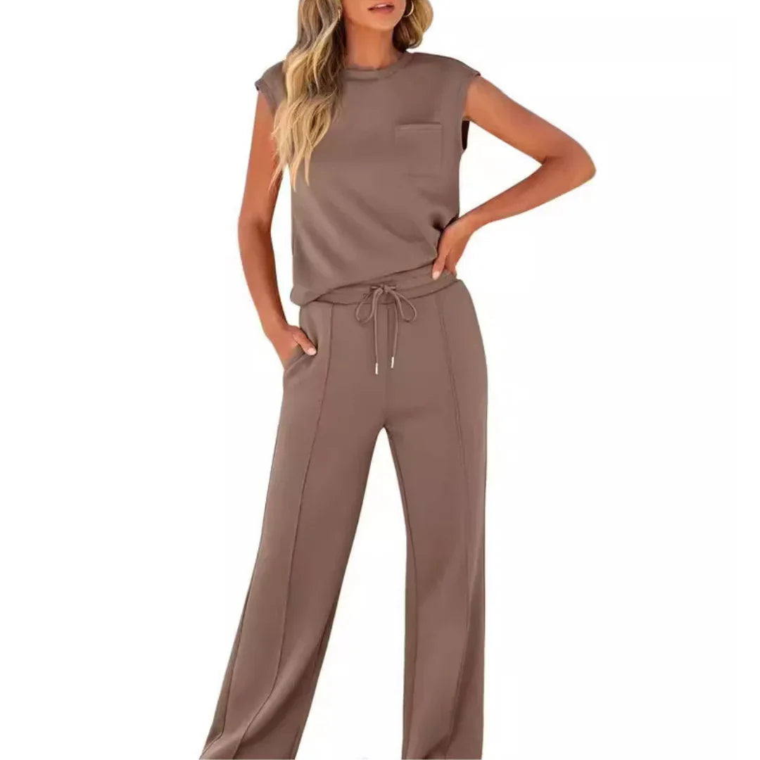 Brown casual lounge set featuring sleeveless top and drawstring pants, studio setting.