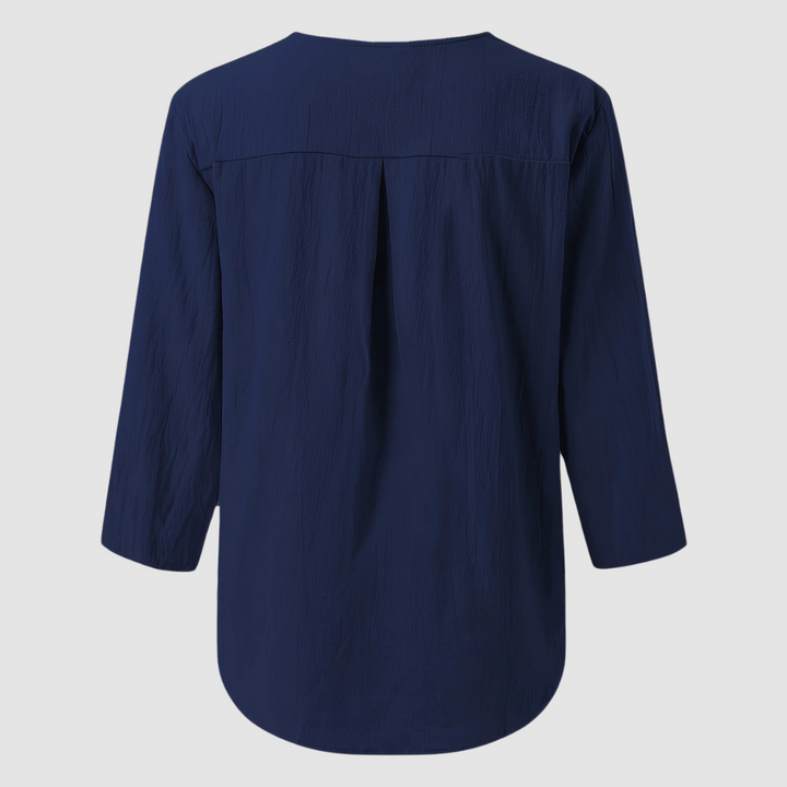 Back view of a navy casual blouse displayed flat against a plain background.