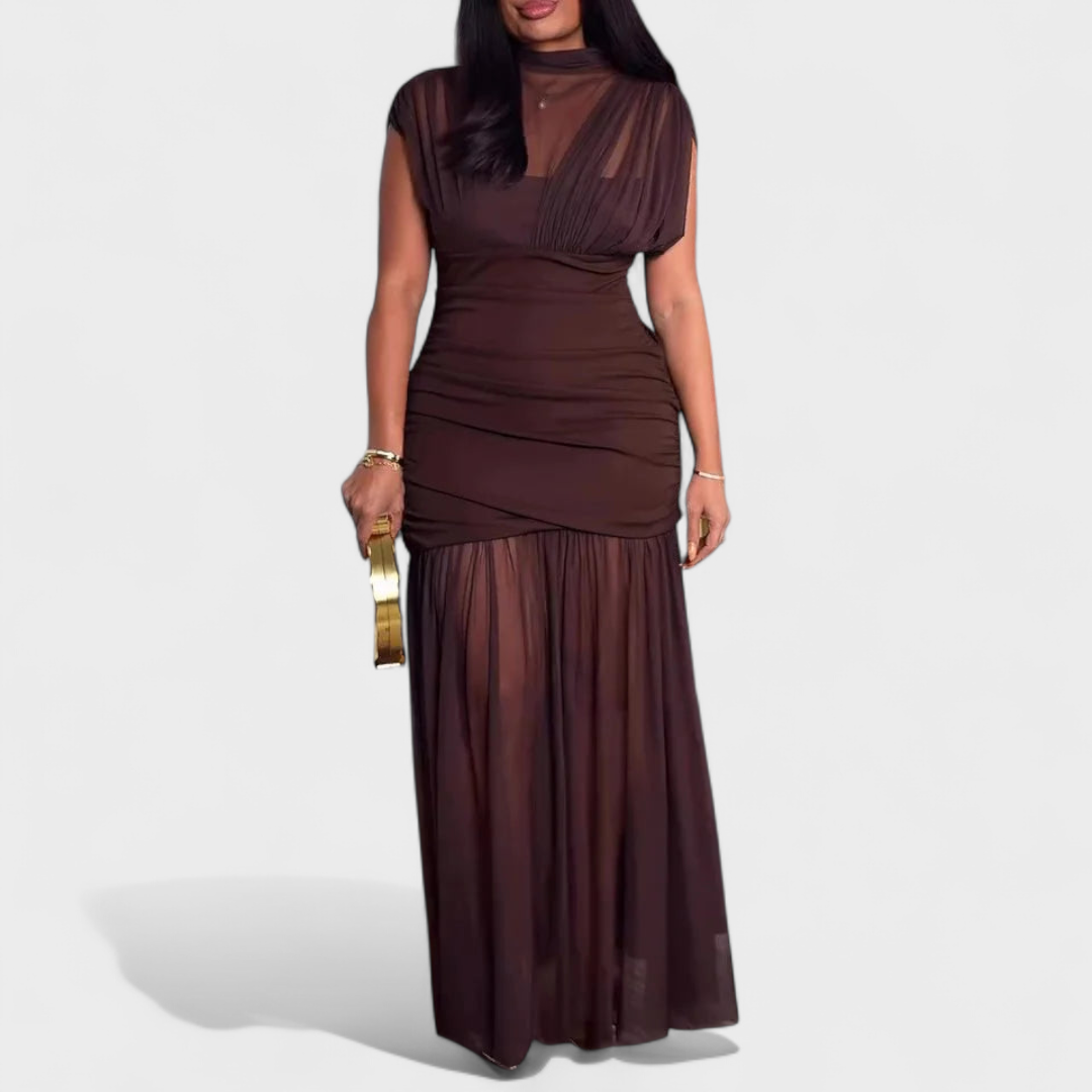 Elegant brown dress with a ruched bodice and flowing skirt, modeled in a studio setting.