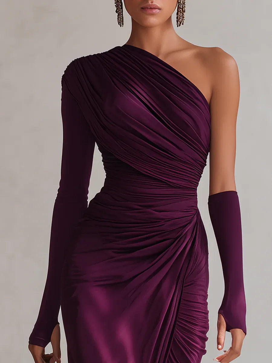 Close-up of purple one-shoulder dress with pleated design and gloves in a neutral background.
