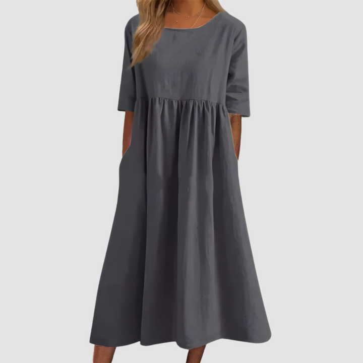 Charcoal gray breezy dress with elbow-length sleeves in a studio setting.