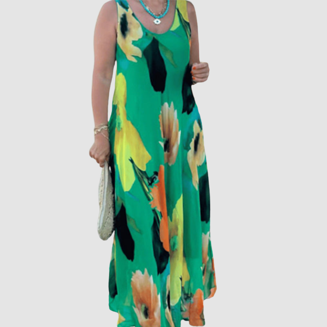 Front view of an elegant green floral dress with a flowy silhouette, modeled on a plain background.