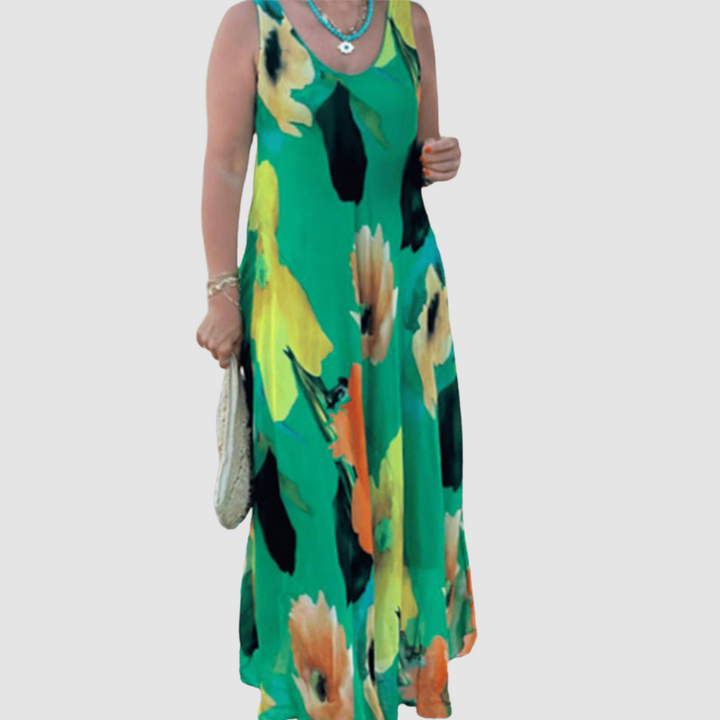 Front view of an elegant green floral dress with a flowy silhouette, modeled on a plain background.