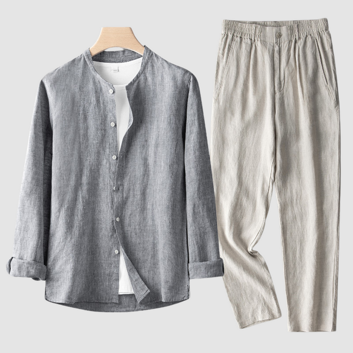Dark gray shirt with beige pants set on a wooden hanger, shown on a plain background.