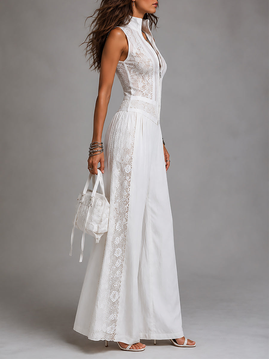 Side view of white stand-collar jumpsuit with lace accents, studio background.