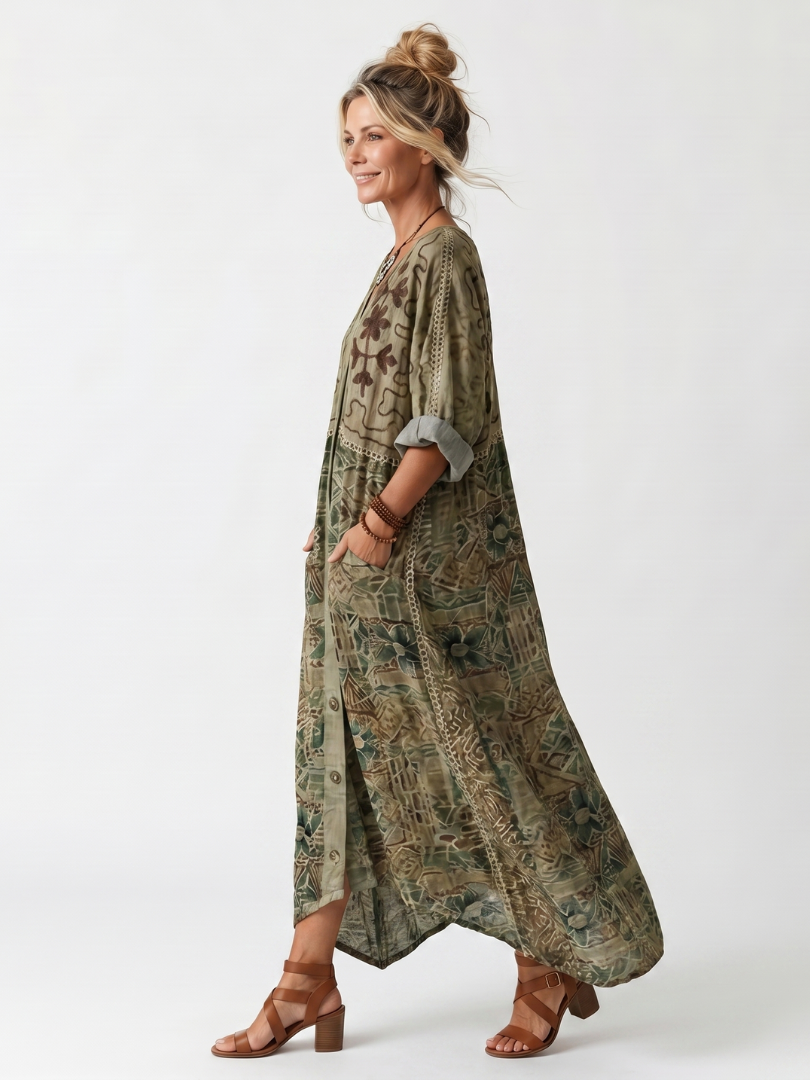 Side view of model in Aleta button-front midi dress with detailed patterns, oversized pockets, studio backdrop.