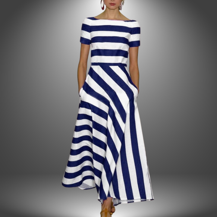 Blue and white striped long dress with short sleeves, photographed in a studio setting.