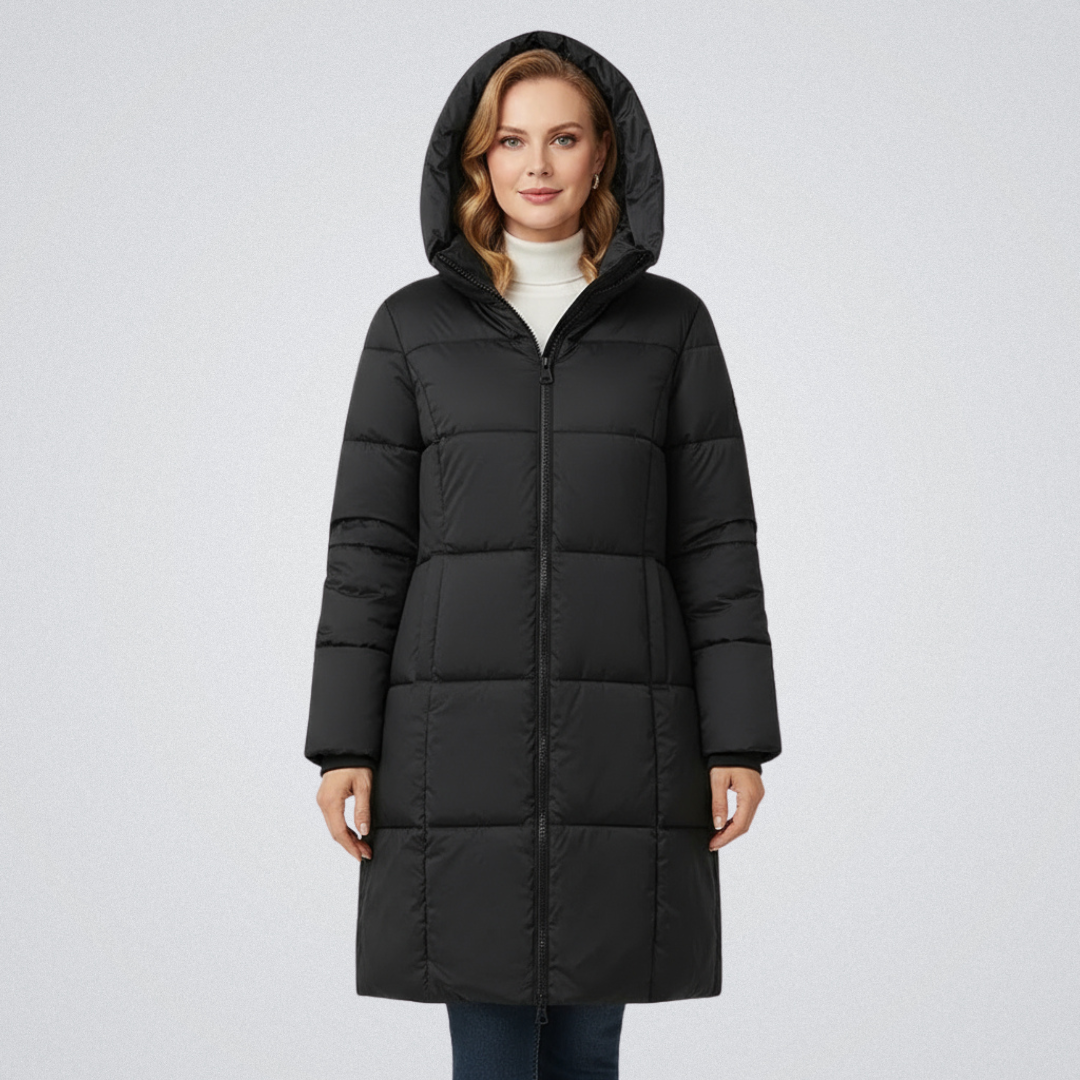 Woman in a black puffer coat with hood, paired with a white turtleneck, against a white background.