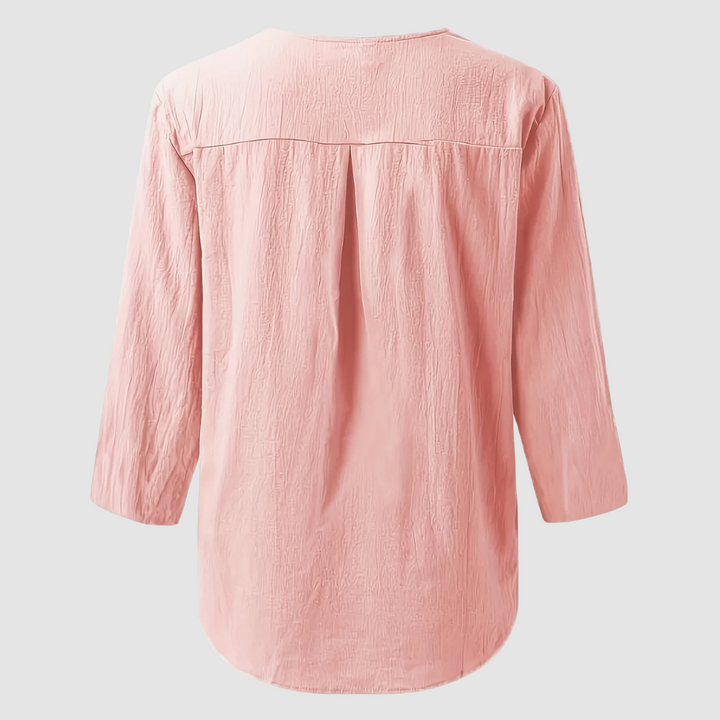 Back view of a pink casual blouse displayed flat against a plain background.