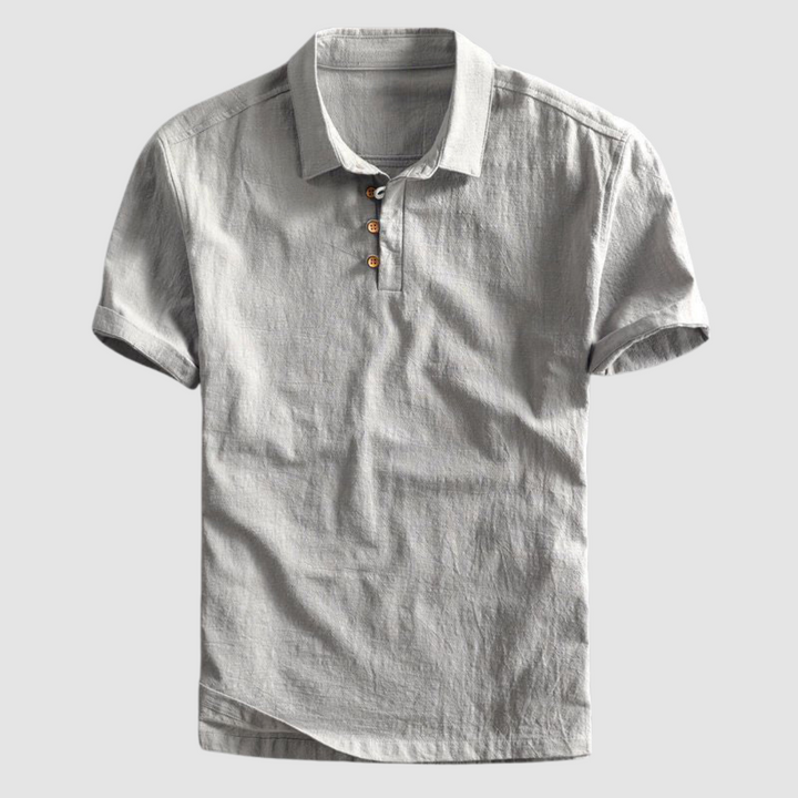 Light gray short-sleeve polo shirt with buttons, set against a neutral light gray background.