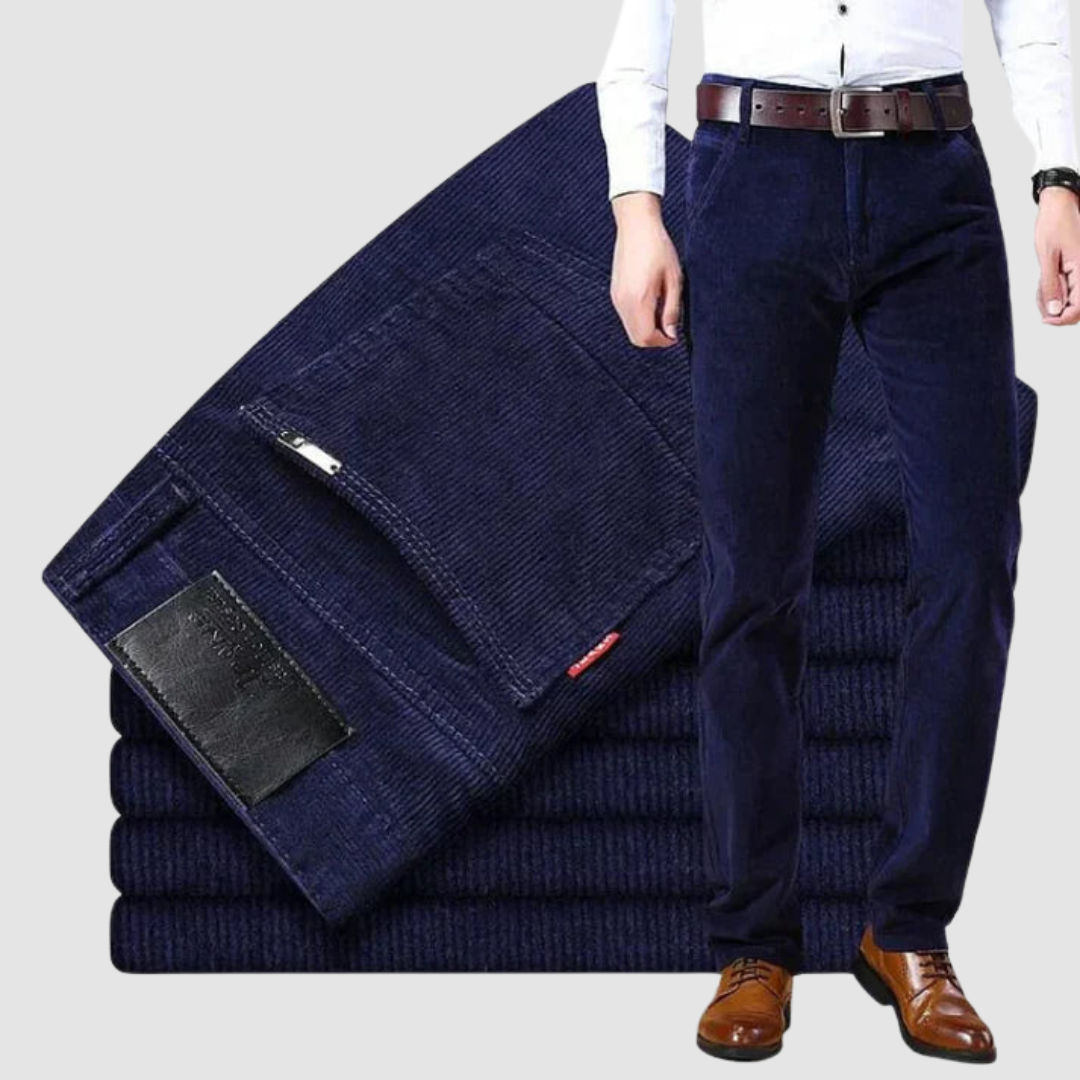 Navy blue corduroy trousers in a studio environment, emphasizing depth of color and soft texture.