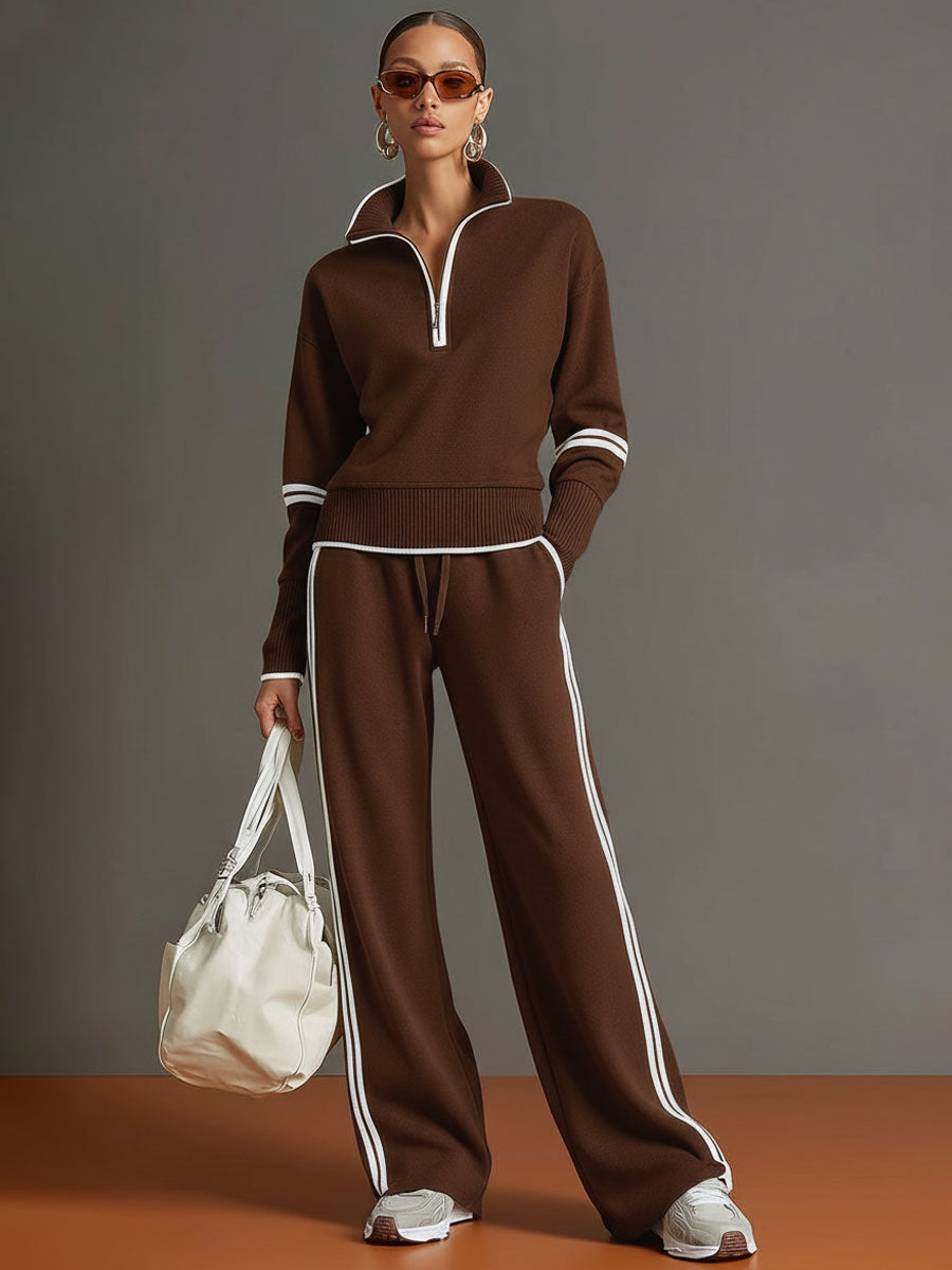 Effortless matching lounge set in brown with contrast stripes, styled with white sneakers and a bag in a studio setting.