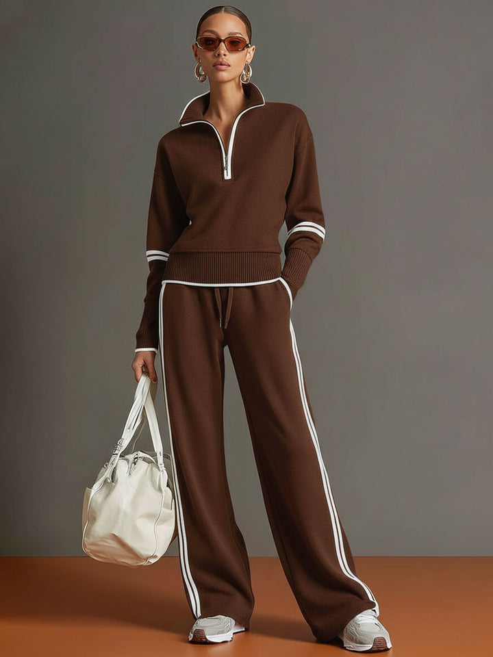 Effortless matching lounge set in brown with contrast stripes, styled with white sneakers and a bag in a studio setting.