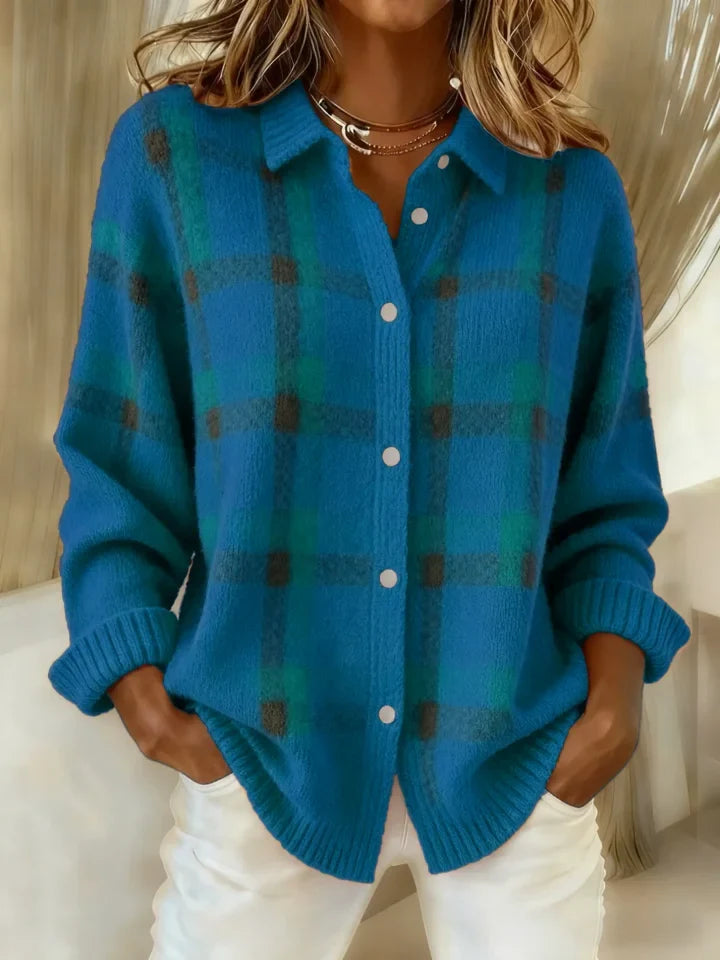 Turquoise plaid button-up shirt with a laid-back vibe, model poses indoors with hands in pockets.