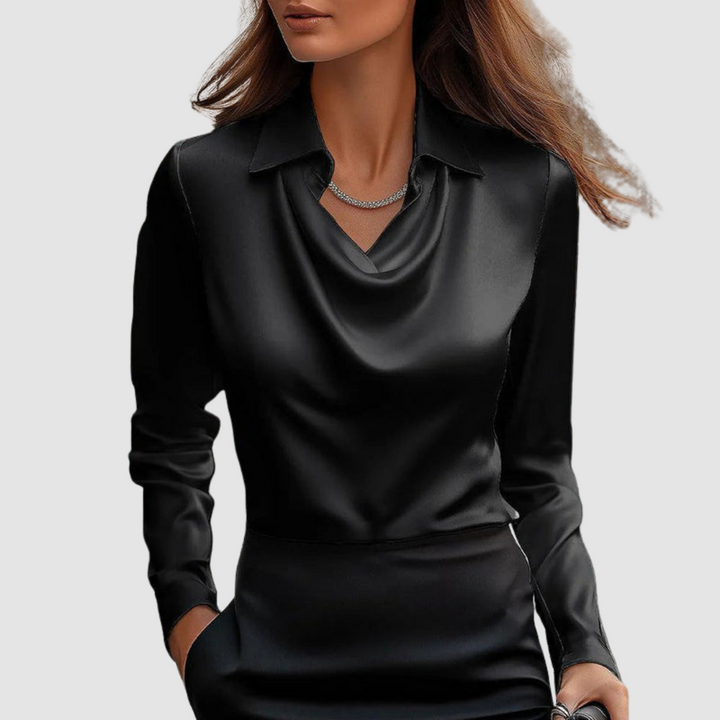 Elegant black satin blouse with a draped neckline and long sleeves, displayed on a plain gray background.