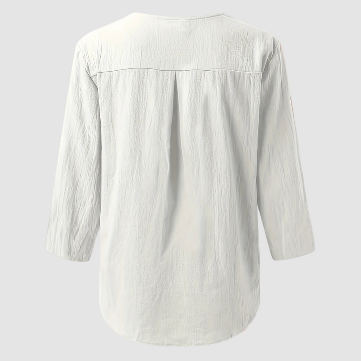 Back view of a white casual blouse displayed flat against a plain background.